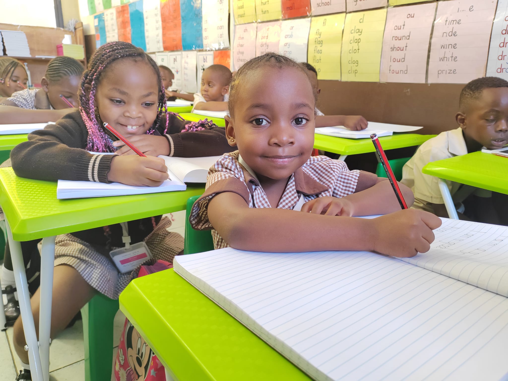 Young Sunshine learners completing classroom work
