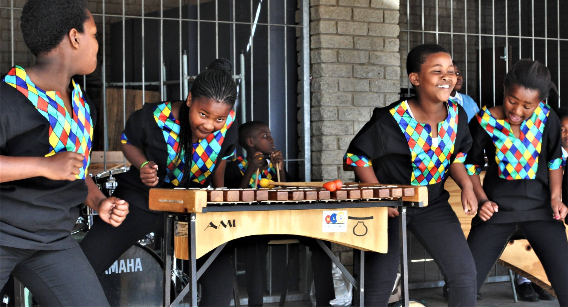Sunshine learners performing together on marimbas