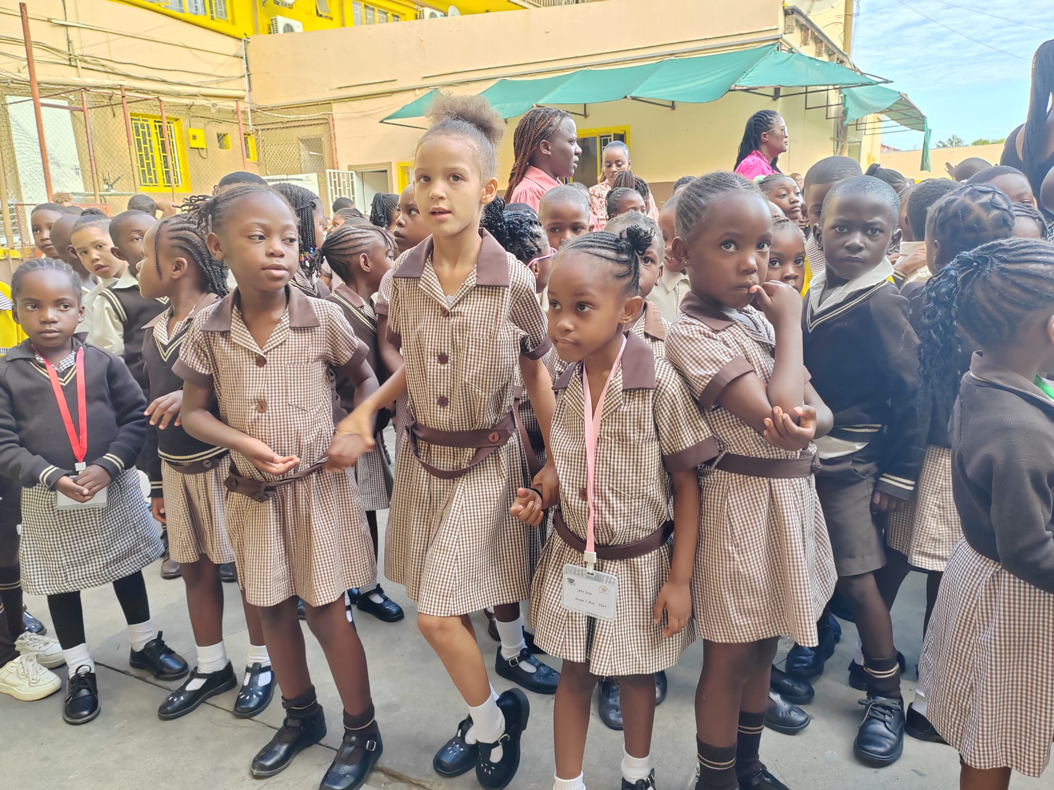 Primary school learners gathered together outdoors