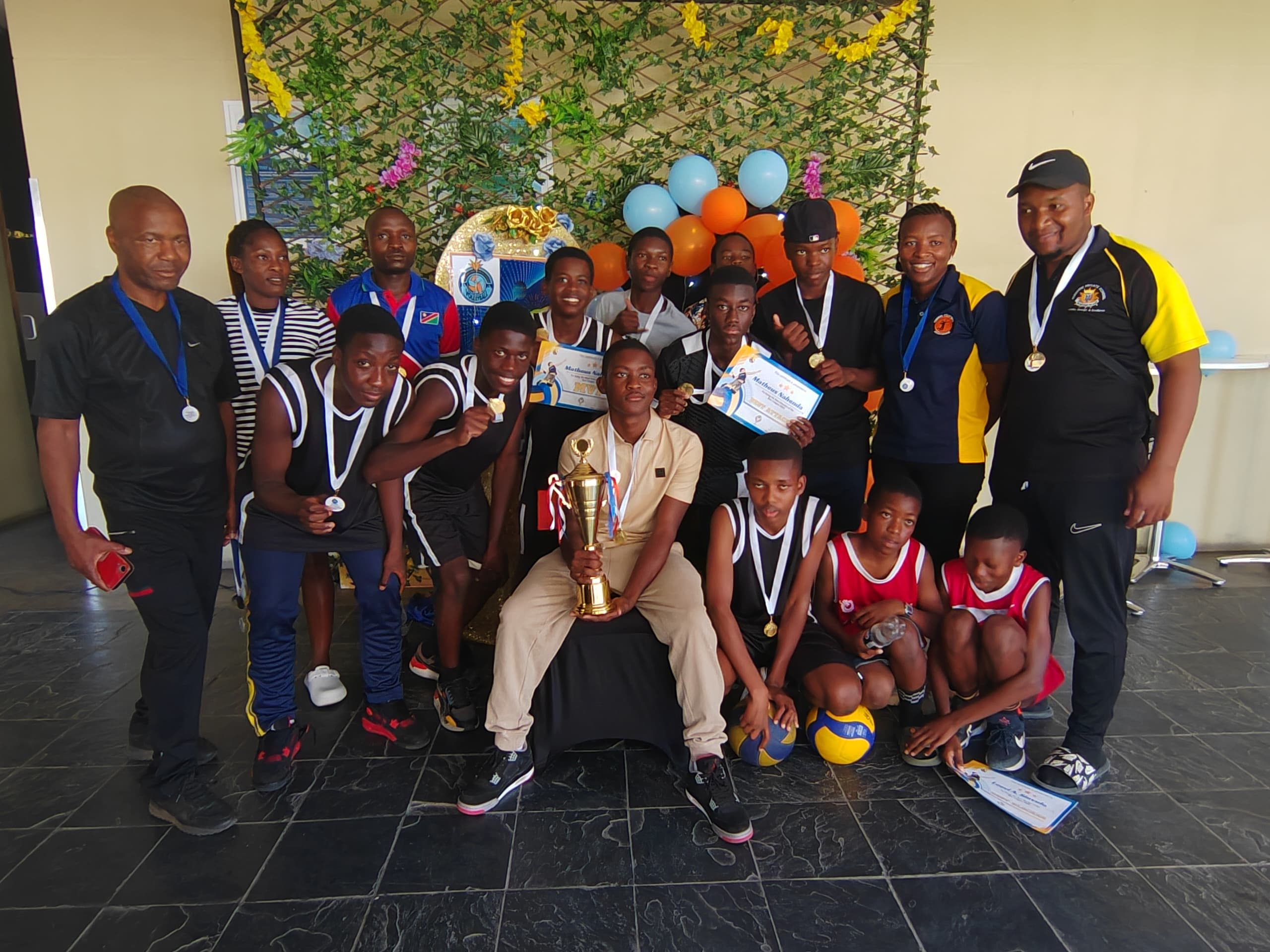 Sunshine volleyball players and coaches celebrating an achievement