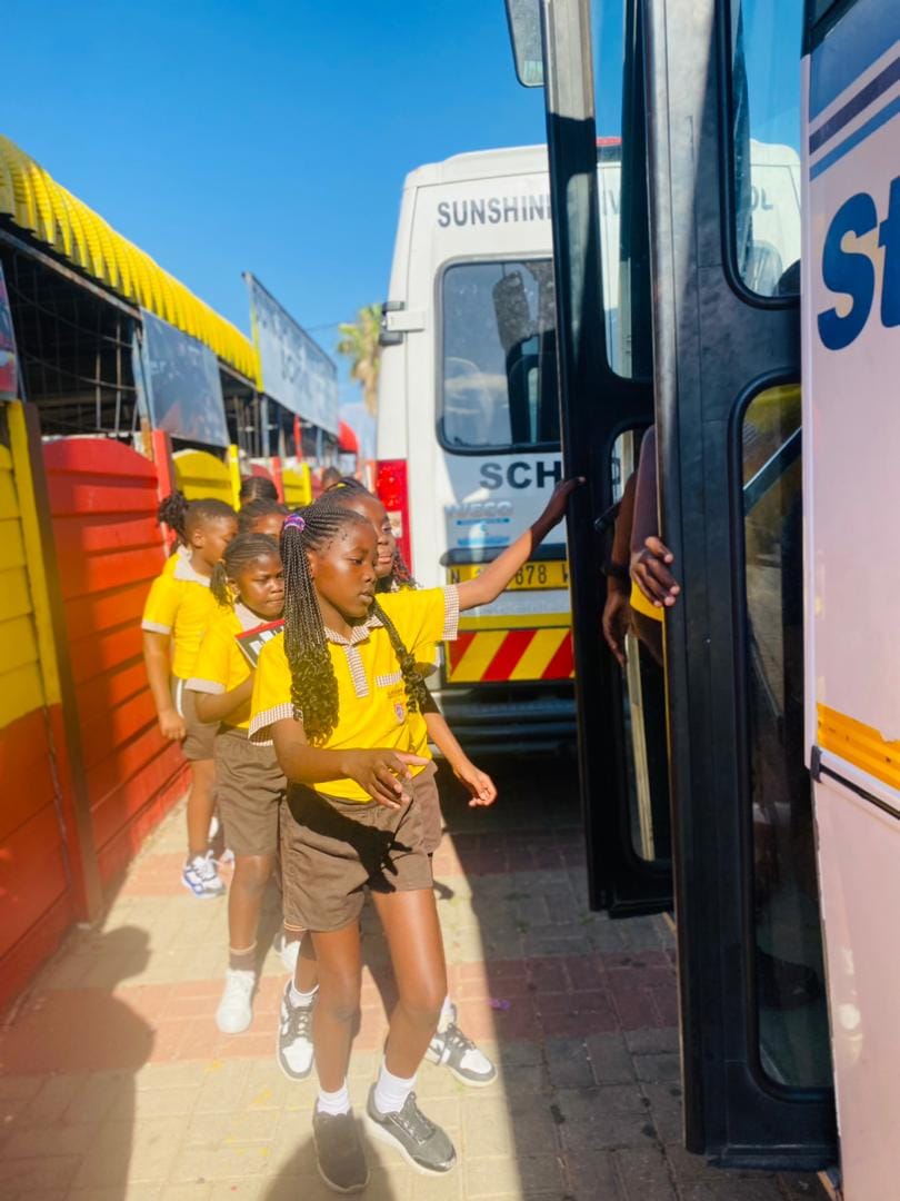 Sunshine learners boarding their school bus in an orderly line